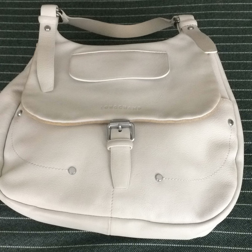 Lady’s white Longchamp leather shoulder/crossbody